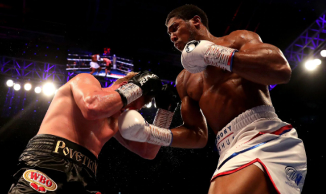Anthony Joshua breaks through Alexander Povetkin's defence CREDIT: GETTY IMAGES Anthony Joshua breaks through Alexander Povetkin's defence CREDIT: GETTY IMAGES
