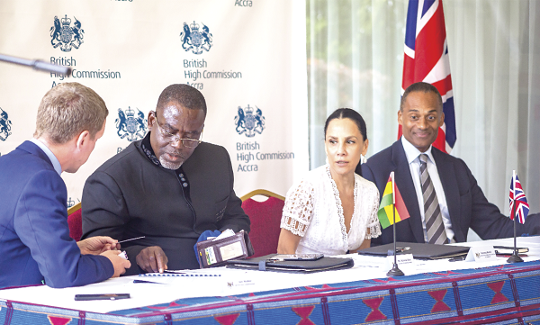 Mr Iain Walker (left) Bristish High Commissioner to Ghana interacting with Mr Kriston Akomeng Kissi, (2nd left), Board Chairman of the PMMC while Madam Baird and Mr Afriyie look on during the signing ceremony. Mr Iain Walker (left) Bristish High Commissioner to Ghana interacting with Mr Kriston Akomeng Kissi, (2nd left), Board Chairman of the PMMC while Madam Baird and Mr Afriyie look on during the signing ceremony.