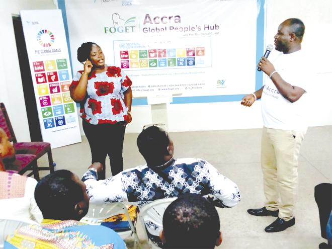 Mr Prosper Afetsi (right) interacting with Ms Sylvia Sefakor Senu (standing left)