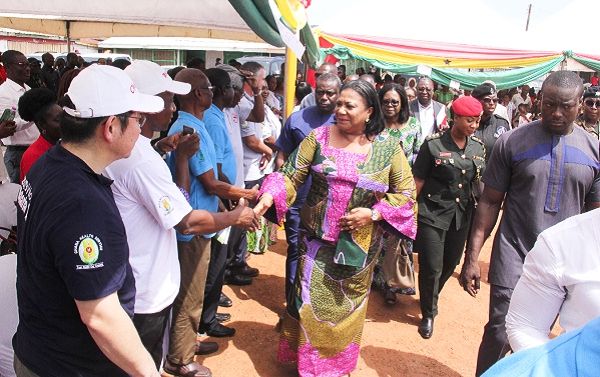 Mrs Rebecca Akufo-Addo (right), the First Lady, exchanging pleasantries with some officials at the event. INSET: Some residents going through medical screening. Picture: EDNA ADU-SERWAA Mrs Rebecca Akufo-Addo (right), the First Lady, exchanging pleasantries with some officials at the event. INSET: Some residents going through medical screening. Picture: EDNA ADU-SERWAA