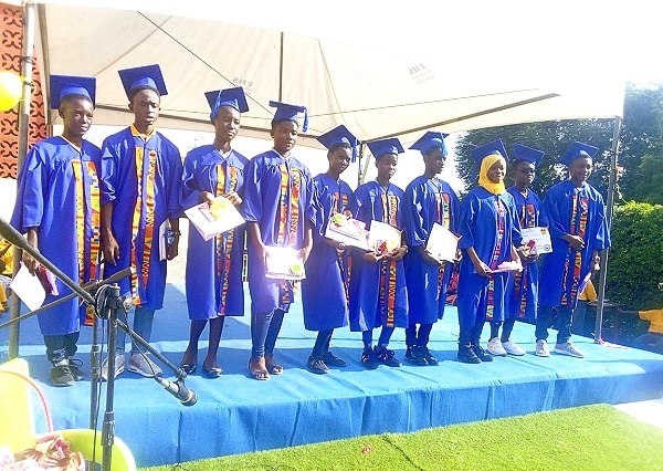 The graduates with their certificates. The graduates with their certificates.