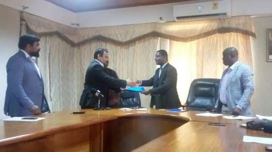 Mr Phadele exchanging the signed MOU with Prof Owusu Sekyere (right)