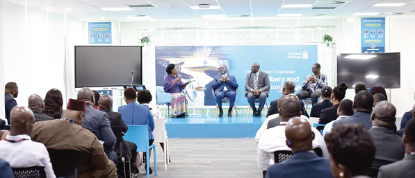 Mr Frank Adu-Poku (2nd left), Mr Julian Wrigley (2nd right) and Mr Senanu Edem (right) addressing participants in the forum.