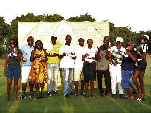 Winners displaying their trophies Winners displaying their trophies