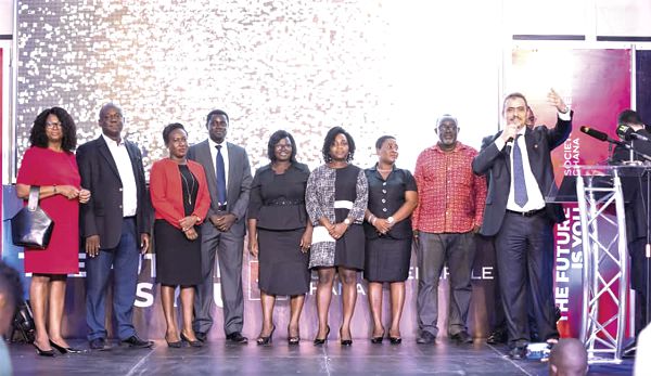  Mr Hakim Ouzzani (right) addressing the gathering. With him are some staff of Societe Generale (SG) Ghana