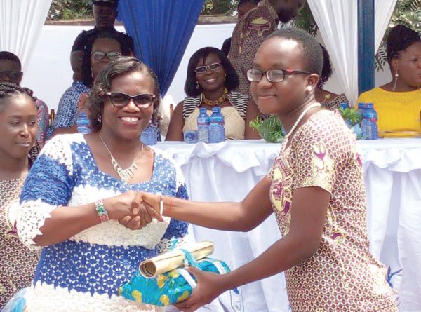 Ms Lady Queene Asiedu-Akrofi (left), Headmistress of the Presbyterian Boys’ Senior High School (Presec), Legon, presenting an award to Ms Naomi Aboagye Dacosta (right), the Overall Best Student.Picture: ESTHER ADJEI Ms Lady Queene Asiedu-Akrofi (left), Headmistress of the Presbyterian Boys’ Senior High School (Presec), Legon, presenting an award to Ms Naomi Aboagye Dacosta (right), the Overall Best Student.Picture: ESTHER ADJEI