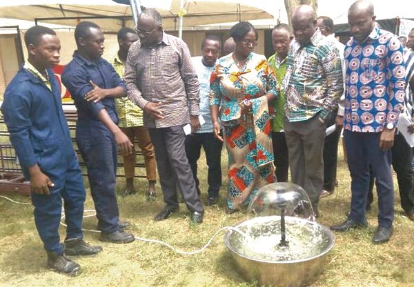 A tutor of Avotrain institute (2nd left) explaining a point to Rev. Prof. Emmanuel Adow Obeng. With them are Mr Dela Gadzanku (right), Prof. Frank S. Arku (2nd right), Vice President of PUCG and Mrs Mary Agyepong, Registrar of PUCG.
