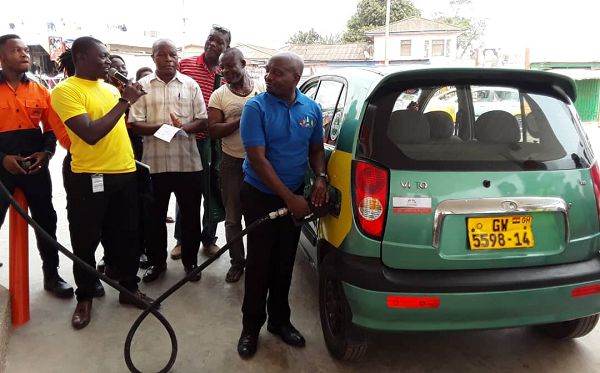 The Managing Director of the company, Mr Emmanuel Pobee, serving the first customer of the station after it was officially opened The Managing Director of the company, Mr Emmanuel Pobee, serving the first customer of the station after it was officially opened
