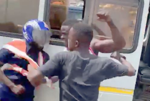 The driver and his mate assaulting the policeman The driver and his mate assaulting the policeman