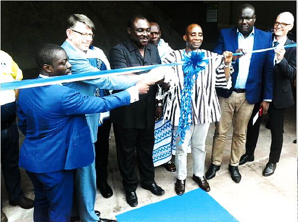 Mr Robert Ahomla Lindsay (3rd from left), Deputy Minister, Trade and Industry, cutting the tape to inaugrate the factory Mr Robert Ahomla Lindsay (3rd from left), Deputy Minister, Trade and Industry, cutting the tape to inaugrate the factory