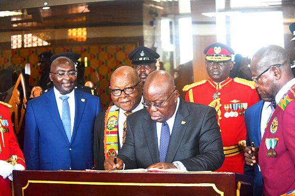 President Nana Addo Dankwa Akufo-Addo, signing the Visitors Book after presenting the SONA