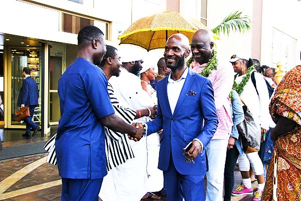  Mr Seth Ocran (right), President, Car Rental Association of Ghana (CRAG), leading the National Black MBA Association members as they are welcomed by the Osu Traditional Council to Ghana. Behind him is Mr Jesse Tyson, President of the National Black MBA Association
