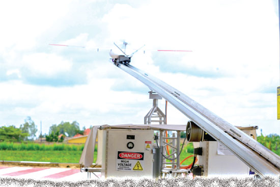A drone (arrowed) taking off from a launcher to deliver blood. This service will be free for patients and medical facilities A drone (arrowed) taking off from a launcher to deliver blood. This service will be free for patients and medical facilities