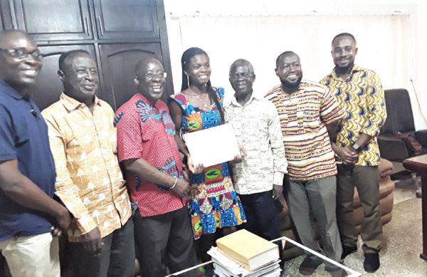 Prof. Obeng Mireku, the VC of Wisconsin (3rd left) and Ms Victoria Appiasah (middle) after the presentation of the scholarship. Looking on are other staff of the university Prof. Obeng Mireku, the VC of Wisconsin (3rd left) and Ms Victoria Appiasah (middle) after the presentation of the scholarship. Looking on are other staff of the university