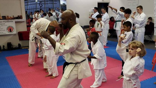 Head instructor Randall Ephraim, center, fought off the suspect