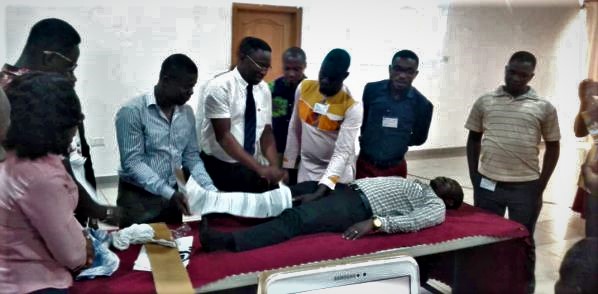 Dr Konadu-Yehoah (in tie) demonstrating how accident victims with fractured leg should be handled before being sent to the hospital Dr Konadu-Yehoah (in tie) demonstrating how accident victims with fractured leg should be handled before being sent to the hospital