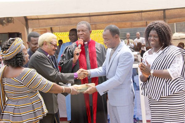 Rev. Daniel Yaw Gbande (2nd right), the out-going General Overseer of the Evangelical Church of Ghana handing over a Bible and a cross to Rev. Maxwell K.K. Liwangul (2nd left), the in-coming General Overseer of the church. Picture: EDNA ADU-SERWAA Rev. Daniel Yaw Gbande (2nd right), the out-going General Overseer of the Evangelical Church of Ghana handing over a Bible and a cross to Rev. Maxwell K.K. Liwangul (2nd left), the in-coming General Overseer of the church. Picture: EDNA ADU-SERWAA