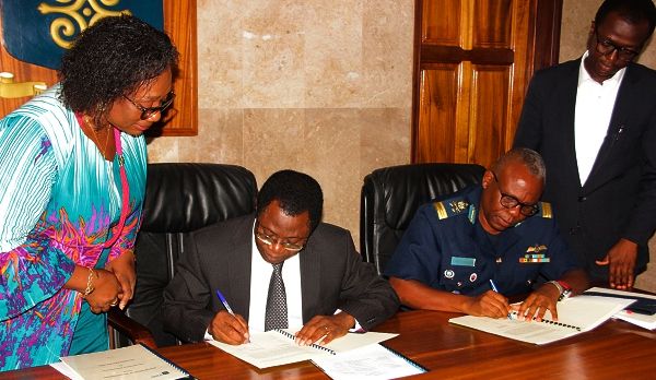 Prof. Samuel Kwame Offei (2nd left) and Air Vice Marshall Frank Hanson (2nd right), signing the memorandum of understanding at the ceremony.Picture: EDNA ADU-SERWAA