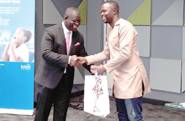 Mr Daniel Sackey (2nd right) presenting the sponsorship package to a beneficiary Mr Daniel Sackey (2nd right) presenting the sponsorship package to a beneficiary