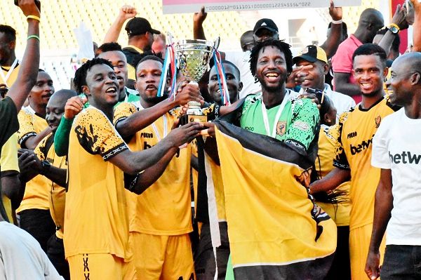 Players of Ashantigold celebrating with the winner’s trophy yesterday.Picture: Dada Oliseh Photos Players of Ashantigold celebrating with the winner’s trophy yesterday.Picture: Dada Oliseh Photos