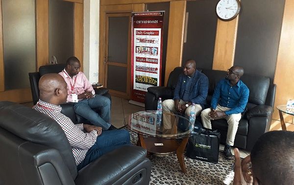 Mr Ato Afful (left), Managing Director of GCGL, Mr Maurice Quansah (2nd left), acting Editor of the Graphic Sports and Mr Clarence Amenya (2nd right) in some discussions during the courtesy call