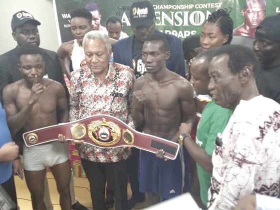 Wasiru (left) and Japhet in a pose with the WBO Africa Super Bamtaweight title after yesterdy’s weigh-in Wasiru (left) and Japhet in a pose with the WBO Africa Super Bamtaweight title after yesterdy’s weigh-in