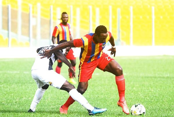 Hearts of Oak striker, Kofi Kodzi (right), attempts to dribble past his Dream FC marker. Picture: EBOW HANSON Hearts of Oak striker, Kofi Kodzi (right), attempts to dribble past his Dream FC marker. Picture: EBOW HANSON