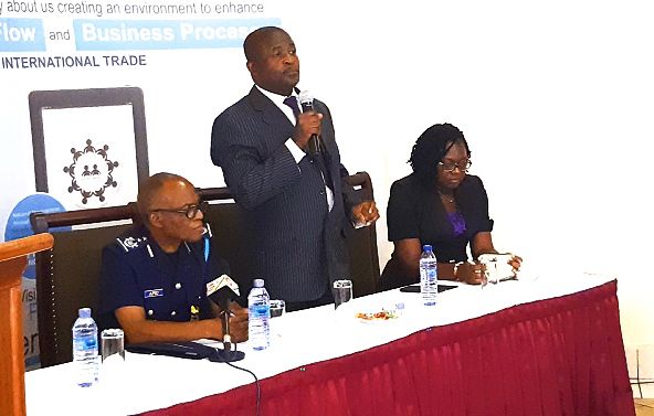 Mr Kwasi Bobie-Ansah (middle) explaining some of the functions of the GTH app at the event