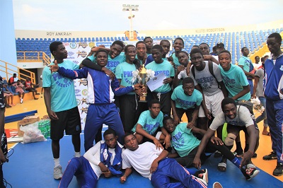 Accra Metropolitan Assembly (AMA) Mayor, Mr Mohammed Adjei Sowah presenting the trophy to PRESEC captain Paa Kofi Ayeh Safori.