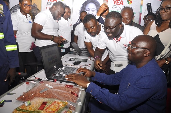 Vice-President Dr Mahamudu Bawumia (seated) being assisted by Mr Agya Yaw, Research and Planning Unit, YEA, to launch the YEA Job Centre Programme Vice-President Dr Mahamudu Bawumia (seated) being assisted by Mr Agya Yaw, Research and Planning Unit, YEA, to launch the YEA Job Centre Programme