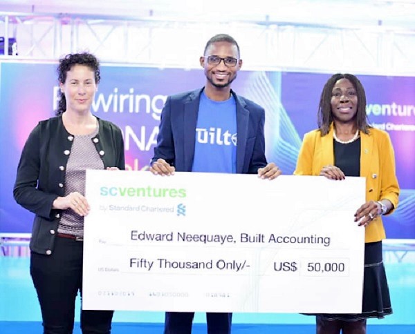 Mr Edward Neequaye (middle) displaying his dummy cheque. With him are Ms Mansa Nettey (right) and Claudia Marcusson from SC Ventures Mr Edward Neequaye (middle) displaying his dummy cheque. With him are Ms Mansa Nettey (right) and Claudia Marcusson from SC Ventures