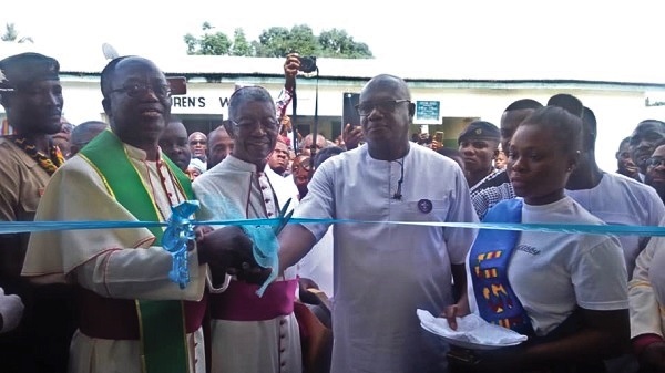 The Catholic Bishop of the Ho Diocese, Most Rev. Emmanuel Kofi Fianu (left), with Mr Prosper Bani (second right) cutting the tape to inaugurate the building (inset) The Catholic Bishop of the Ho Diocese, Most Rev. Emmanuel Kofi Fianu (left), with Mr Prosper Bani (second right) cutting the tape to inaugurate the building (inset)