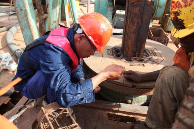 Chinese workers are involved in several major construction projects in TanzaniaImage caption: Chinese workers are involved in several major construction projects in Tanzania