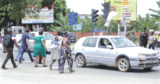 Pedestrains crossing the road in front of the 37 Military Hospital in Accra. Pedestrains crossing the road in front of the 37 Military Hospital in Accra.