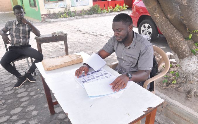 Exhibition officials of the Electoral Commission sitting idle waiting for voters to have their names checked at some centres visited at Adabraka in Accra. Picture: SAMUEL TEI ADANO Exhibition officials of the Electoral Commission sitting idle waiting for voters to have their names checked at some centres visited at Adabraka in Accra. Picture: SAMUEL TEI ADANO