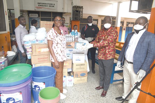 Mr Kwabena Agyei-Boahene (2nd right) presenting one of the items to Dr Maame Yaa Nyarko of the hospital, in Accra on Tuesday Mr Kwabena Agyei-Boahene (2nd right) presenting one of the items to Dr Maame Yaa Nyarko of the hospital, in Accra on Tuesday