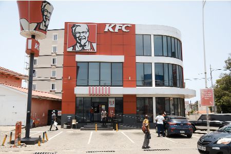 • Osu branch of KFC is one of the most patronised in the city of Accra. INSET: Customers washing their hands before entering the restaurant • Osu branch of KFC is one of the most patronised in the city of Accra. INSET: Customers washing their hands before entering the restaurant