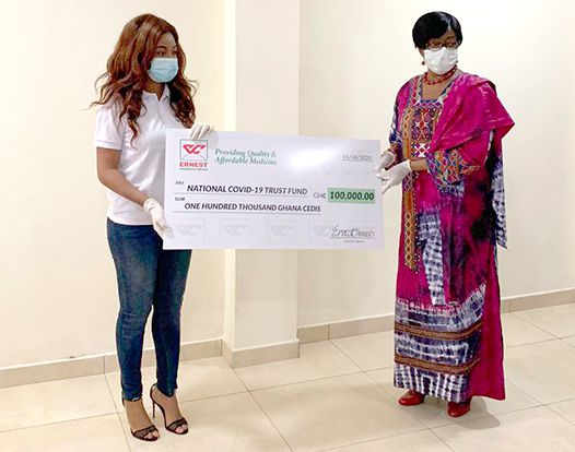  Mrs Sharon Anim (left) presenting the dummy cheque to Justice Sophia Akuffo