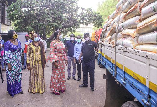  Mr George Otchere (right) showing the items to Mrs Cynthia Mamle Morrison (3rd left)