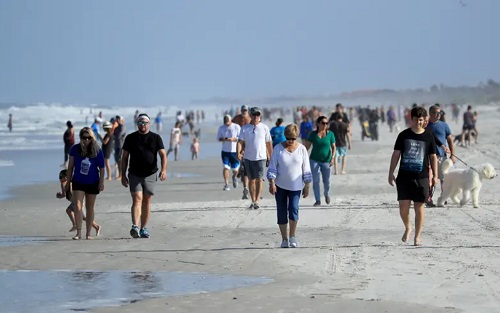A crowd of people at the beach in Jacksonville. COVID-19: Florida reopens beaches