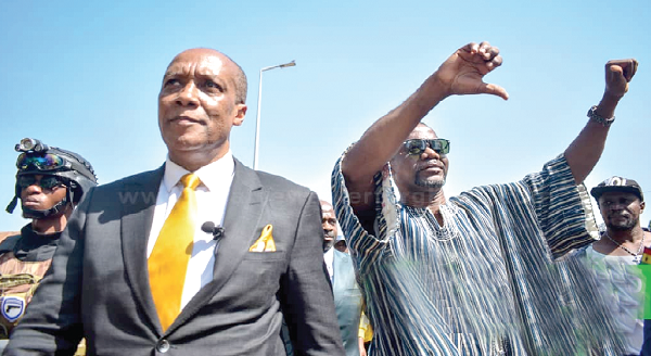 Mr Kwame Asiedu Walker (left) with Mr Jacob Osei Yeboah, acknokwledging cheers during their campaign tour I’ll curb corruption, alleviate poverty — Alfred Walker