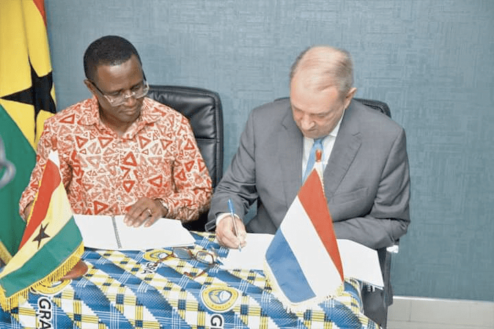 Mr Ron Strikker (right) signing the agreement while Mr Ammishaddai Owusu-Amoah looks on  Mr Ron Strikker (right) signing the agreement while Mr Ammishaddai Owusu-Amoah looks on