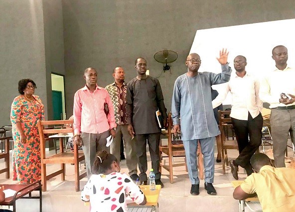 Prof. Opoku-Amankwa (hand raised) and other officials at the Accra College of Education centre