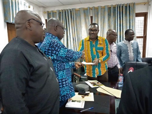 Mr Kwaku Asomah-Cheremeh (2nd left), Minister of Lands and Natural resource, receiving the cheque on behalf of the government. Mr Kwaku Asomah-Cheremeh (2nd left), Minister of Lands and Natural resource, receiving the cheque on behalf of the government.