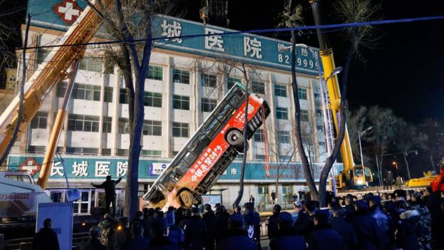 According to state media, the sinkhole stretched nearly 10m (32 feet) in diameter According to state media, the sinkhole stretched nearly 10m (32 feet) in diameter
