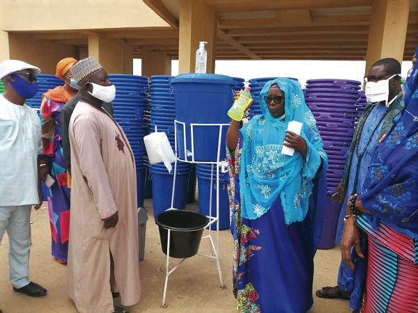 Hajia Alima Mahama (right) presenting a bottle of liquid soap to Alhaji Khuzaima for the Muslim community Hajia Alima Mahama (right) presenting a bottle of liquid soap to Alhaji Khuzaima for the Muslim community