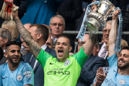 Ederson and Bernardo Silva of Manchester City with FA trophy during the FA Cup Final match between Manchester City and Watford at Wembley Stadium on May 18, 2019 in London, England Ederson and Bernardo Silva of Manchester City with FA trophy during the FA Cup Final match between Manchester City and Watford at Wembley Stadium on May 18, 2019 in London, England
