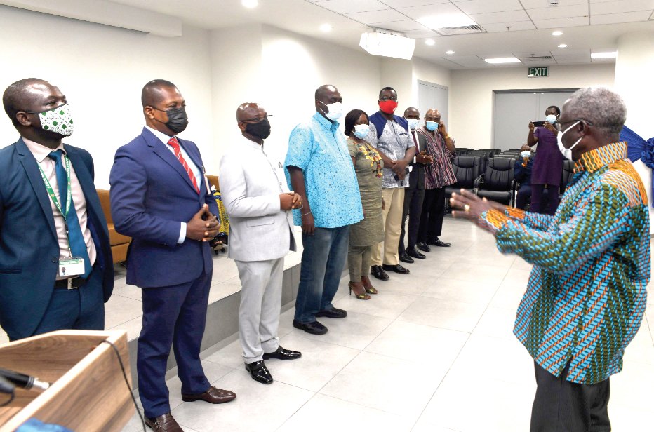  Mr Yaw Osafo-Maafo (right), the Senior Minister, interacting with members of the 10-member committee after the inauguration in Accra yesterday