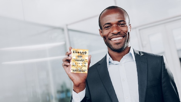 A man displaying a Powerball lottery ticket A man displaying a Powerball lottery ticket