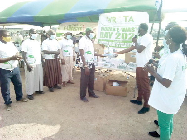 Mr Gilbert Odjidja (with mic) making the presentation to Mr Mohammed Ali Mr Gilbert Odjidja (with mic) making the presentation to Mr Mohammed Ali